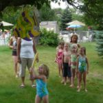 Children playing with the piñata at the party on the island at Esquire Estates in Germantown Wisconsin