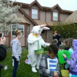 Image of the easter bunny visiting the kids on their Easter egg hunt