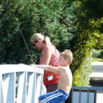 Mother and son enjoying the view of the pond from the south bridge