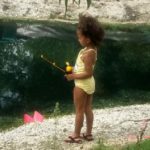 A little gal fishing on the pond at Esquire Estates