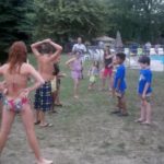 Kids playing a game on the island by the pool at Esquire Estates during the annual picnic